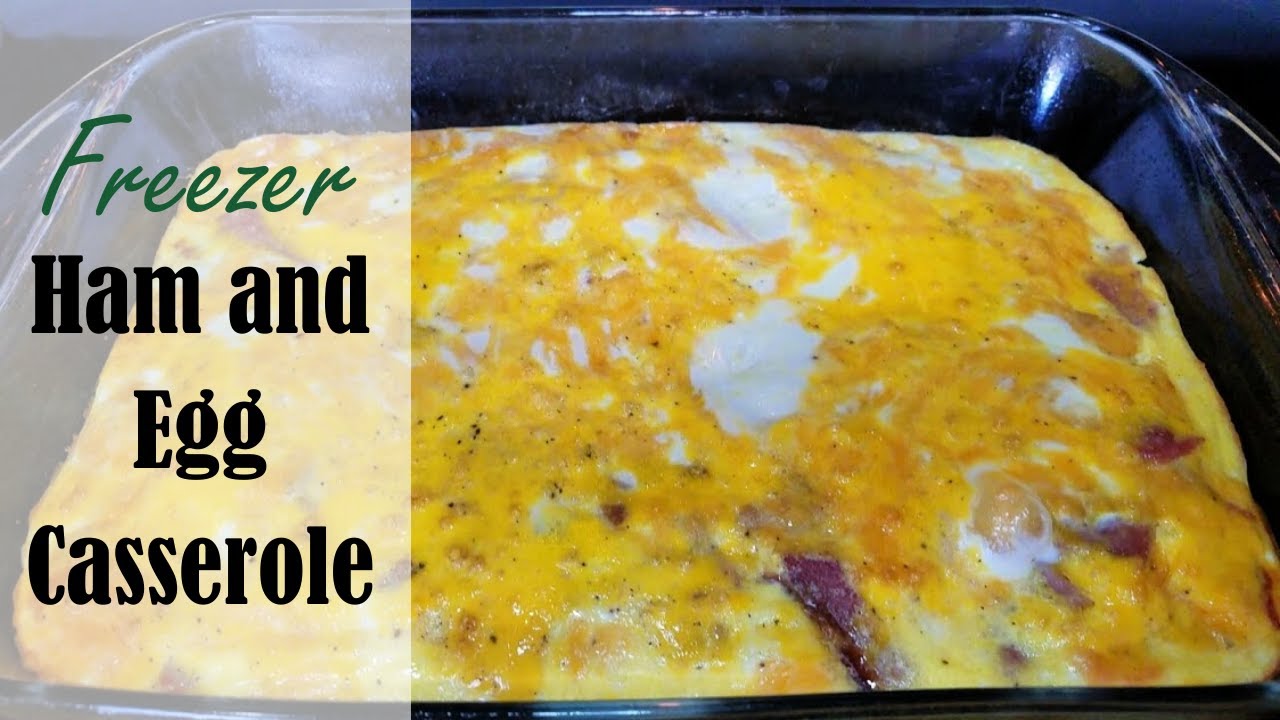 Sliced ham and cheddar egg casserole in a baking dish, ready to portion and freeze for breakfast