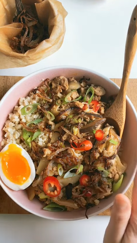 Bowl of jasmine rice topped with Instant Pot Taiwanese meat sauce, crispy shallots, scallions and a soft-boiled egg